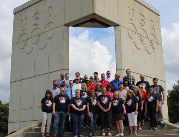 Champaign Paralympian Nichole Millage (front, third from right) takes a photo with co-workers from the city at the Dodds Park Olympic and Paralympic Tribute Thursday,