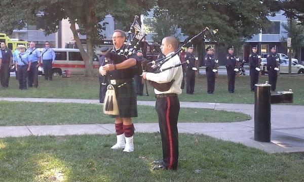 Two bagpipers at the 9-11 memorial ceremony at West Side Park in Champaign. 