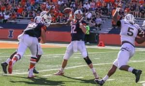 Western Michigan defenders close in on Illini quarterback Wes Lunt. 