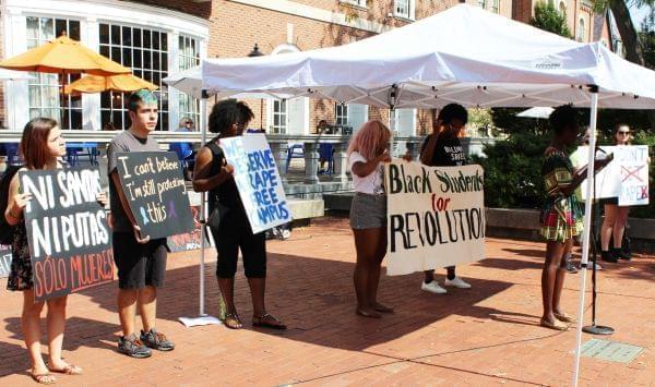 Kailah McGee with Black Students for Revolution addresses a crowd on the U of I Quad Friday.