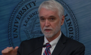 U of I President Tim Killeen discusses the performance-based funding measure before university Trustees Thursday in Chicago.