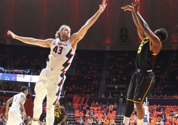 Michael Finke (43) arrives too late to block a three-pointer by Winthrop player Keon Johnson.