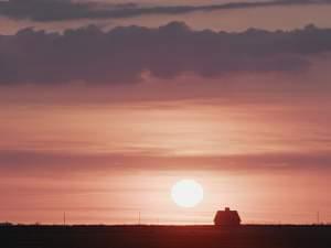 Barn against a sunset