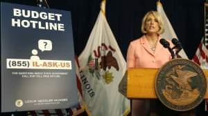 Illinois Comptroller Leslie Geissler Munger begins a news conference on the state budget Thursday, July 14, 2016, in Chicago.