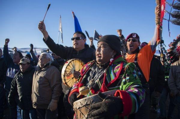 Protestors celebrate at Oceti Sakowin Camp earlier today.