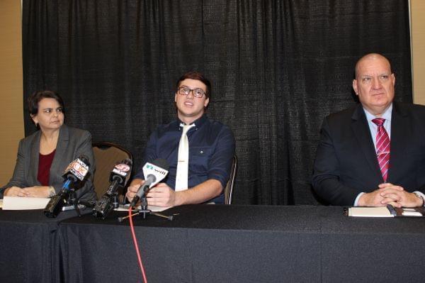 Urbana resident Bryton Mellott (middle) addresses the media, along with ACLU of Illinois attorney Rebecca Glenberg and spokesperson Ed Yohnka.