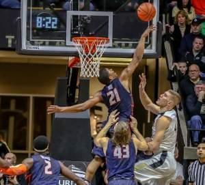 Illini Malcolm Hill rejects Purdue's Isaac Haas during the Boilermakers 91-68 win over Illinois.