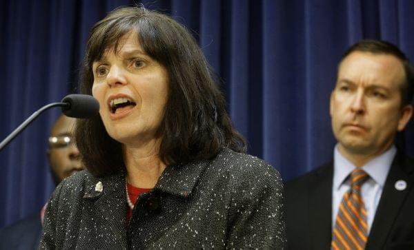 Illinois Rep. Sue Scherer, D-Decatur, left, speaks to reporters, while Illinois Sen. Andy Manar, D-Bunker Hill, right, looks on, during a news conference at the Illinois State Capitol Wednesday, Jan. 20, 2016.