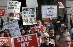 Supporters of the Affordable Care Act, who are also opponents of Colorado's GOP-led plan to undo Colorado's state-run insurance exchange, gather for a rally on the state Capitol steps in Denver, Tuesday, Jan. 31, 2017.