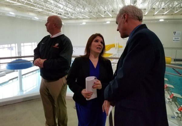 Lt. Gov. Evelyn Sanguinetti talks to Urbana Park District Executive Director Tim Bartlett during a stop at the Urbana Indoor Aquatic Center.