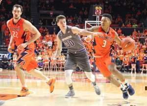 Illini Te'jon Lucas (3) dribbles past Northwestern's Bryant McIntosh (30) Tuesday night in Champaign.