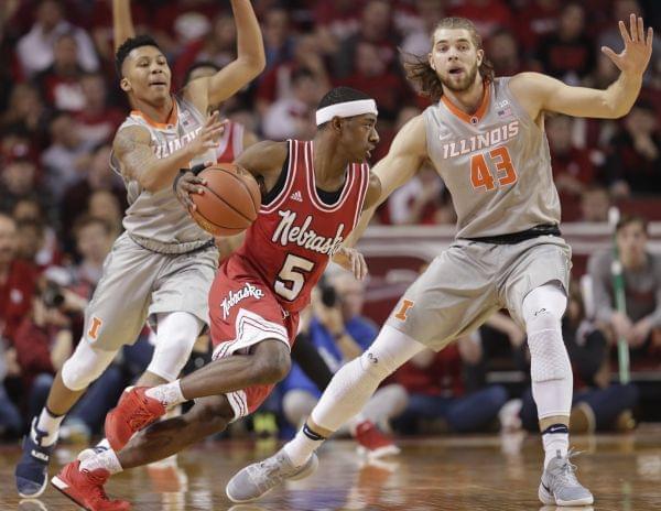 Nebraska's Glynn Watson Jr. (5) drives around Illinois' Te'Jon Lucas, left, and Michael Finke (43) during the first half of an NCAA college basketball game in Lincoln, Neb., Sunday, Feb. 26, 2017. 