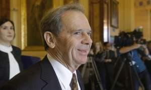 Illinois Senate President John Cullerton, D-Chicago, walks into Illinois Gov. Bruce Rauner's office during veto session at the Illinois State Capitol Wednesday, Nov. 30, 2016, in Springfield.