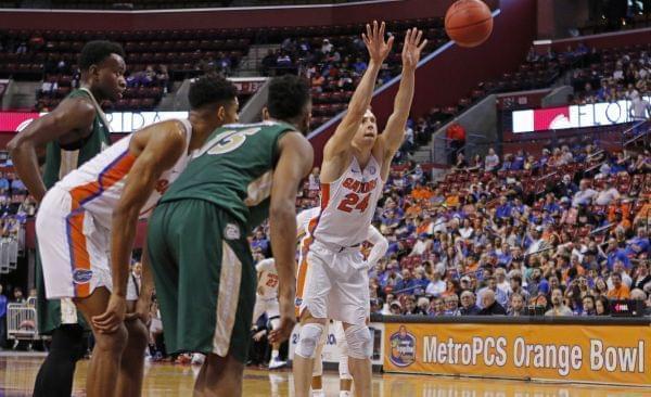 A basketball shooting a free throw underhand