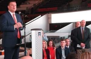 New Illinois basketball coach Brad Underwood addresses the media, while his family and Illini athletic staff look on.