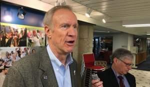 Gov. Bruce Rauner speaks with reporters in Springfield.
