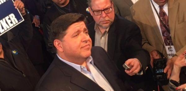 J.B. Pritzker talks with reporters