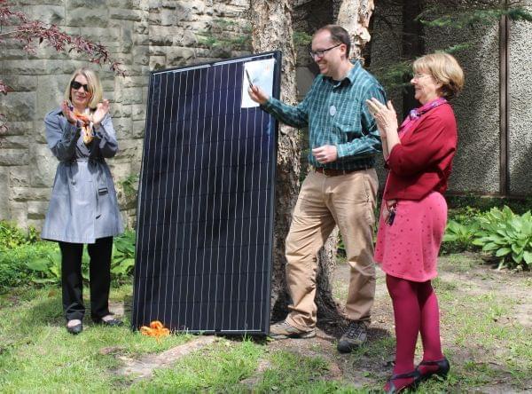 Urbana Mayor Diane Marlin, Andy Robinson of Unitarian Universalist Church, and Rev. Cindy Shepard of Faith in Place participate in Monday's ribbon cutting at the church. 