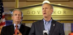 Illinois Gov. Bruce Rauner speaks to reporters in front of his office at the Illinois State Capitol on June 30, 2016, in Springfield. Looking on is Illinois House Minority Leader Jim Durkin.