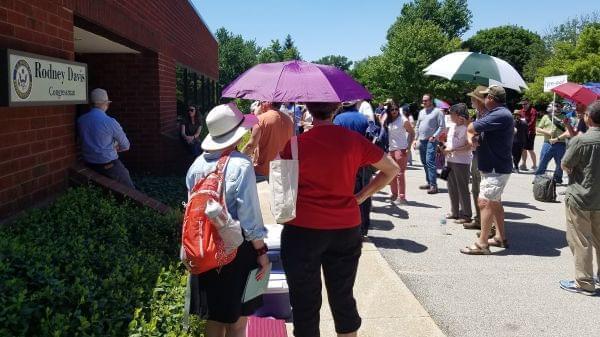 Demonstrators outside the Champaign office of U.S. Rep. Rodney Davis (R-Taylorville). 