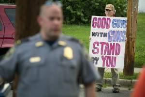 Jeff Hulbert, of Annapolis, Md., epresses his opinion as residents of Alexandria, Va., leave a prayer service near the baseball field in Alexandria, Va., Wednesday, June 14, 2017. A rifle-wielding attacker opened fire on Republican lawmakers at a con