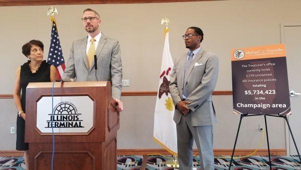 Savoy resident Doris McGee, State Treasurer Mike Frerichs and Andre Jordan, of AARP Illinois.