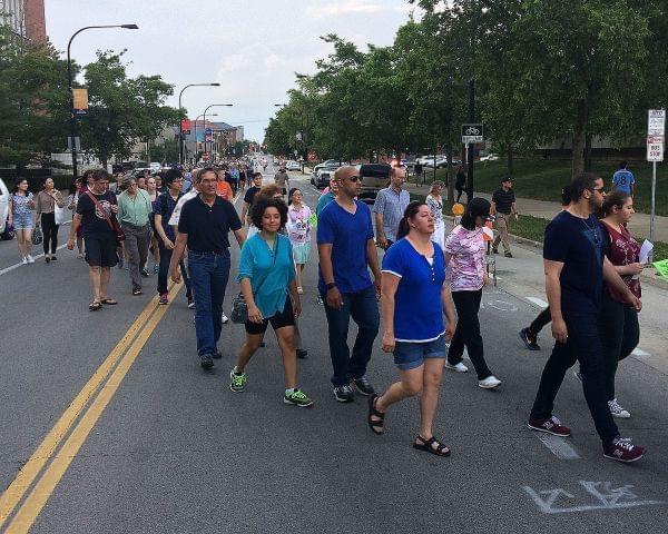 Marchers head toward the Krannert Center in Urbana Thursday night for a concert for missing Chinese scholar Yingying Zhang.