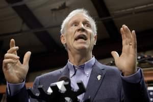 Gov. Bruce Rauner speaks to reporters in Springfield, Ill. The Illinois House passed both a budget and an income-tax increase Sunday, but Gov. Bruce Rauner has promised to veto the tax-hike.