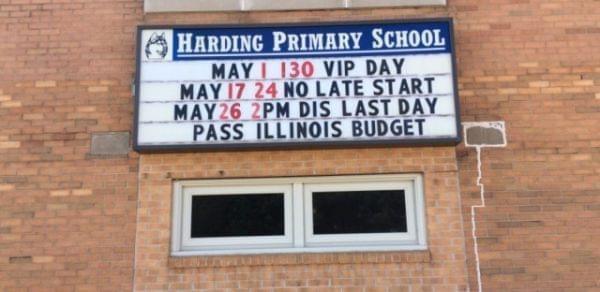 A marquee outside of Harding Primary School in Monmouth, IL. urges state lawmakers to pass a budget. 