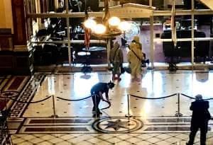 Hazmat crew enters the governor's office at the Illinois Statehouse Thursday.
.