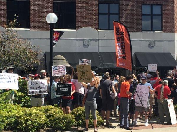 A crowd rallies against fascism and racism Sunday in downtown Champaign.