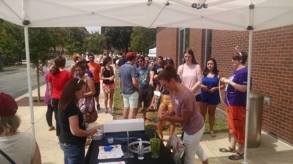 People line up at the Champaign Public Library to receive special glasses to view the solar eclipse.