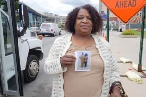 Janice McClain poses beside the Use What You've Got Prison Ministry bus, which connects people with their incarcerated family members.