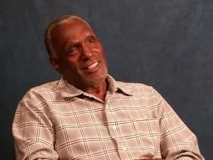 A man being interviewed on camera in a studio