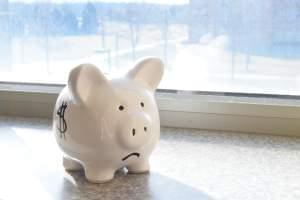 Piggy bank with sad face.