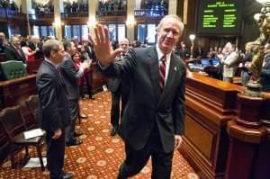 Gov. Bruce Rauner walks through the Illinois House before his annual budget address in this file photo from earlier this year.