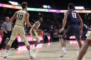 Wake Forest guard Bryant Crawford squares up for a three-pointer while Illini freshman Mark Smith defends in Illinois' 80-73 loss on Tuesday.