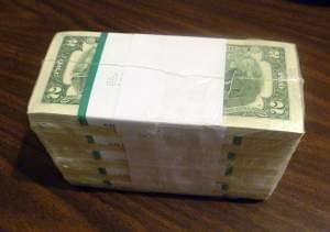 Stack of two dollar bills.