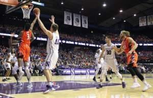 Illini Michael Finke (43) and Northwesterns Bryant Mcintosh (30) watch Te'Jon Lucas drive past Gavin Skelly (44) for a lay up.