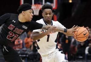 Illinois guard Trent Frazier, right, drives to the basket as New Mexico State guard Zach Lofton defends during the second half of an NCAA college basketball game Saturday, Dec. 16, 2017, in Chicago.