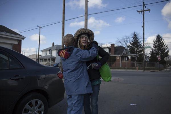 Sister Nadine of the Sisters devotion embraces one of the many women she helps in the Hilltop area of Columbus,Ohio.