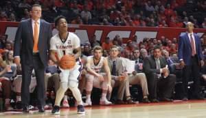 Trent Frazier shoots a three-pointer during a 104-97 overtime loss to Iowa.