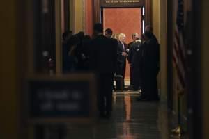 Senate Majority Leader Mitch McConnell of Ky., center, and Sen. Roy Blunt, R-Mo., at the end of a close-door meeting with fellow Republican senators, Monday, Jan. 22, 2018, on Capitol Hill in Washington on day three of the government shutdown.