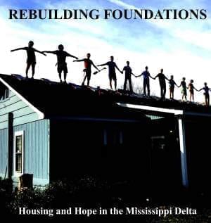 Students standing on the roof of a house.