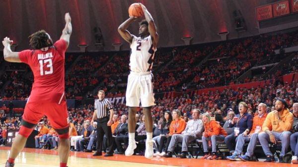Former Illini Deron Williams (far right) watches Kipper Nichols score three of his 19 points Tuesday night versus Rutgers in a 91-60 Illinois win.