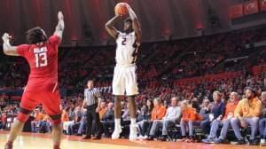 Former Illini Deron Williams (far right) watches Kipper Nichols score three of his 19 points Tuesday night versus Rutgers in a 91-60 Illinois win.