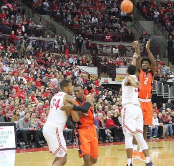 Illini Kipper Nichols shoots over Ohio State's Keita Bates-Diop while Illinois' Deron Black struggles with Ohio State's Kaleb Wesson.