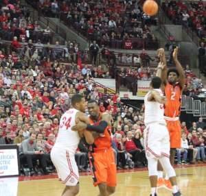 Illini Kipper Nichols shoots over Ohio State's Keita Bates-Diop while Illinois' Deron Black struggles with Ohio State's Kaleb Wesson.