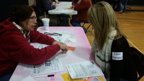 Participants in a poverty simulation