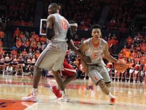 Leron Black (12) screens Nebraska's Glynn Watson to give Te'Jon Lucas (3) an opening toward the basket during a 72-66 Illinois win in Champaign.